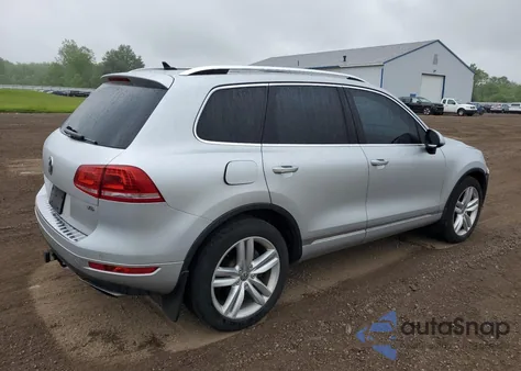 2014 Volkswagen Touareg V6 z USA, uszkodzony, nr VIN WVGEF9BP0ED014429